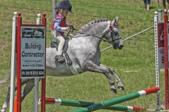 4826 - Sienna Jessop (5) of Bega competes in the Crossrail event on her horse Tye.